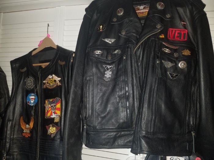 Harley Davidson heavy leather jacket & vest with lots of pins & patches.