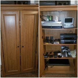 Free standing cabinet/closet. 2 available. Electronics including Samsung cordless chargers, computer monitor, DVD players, & more.