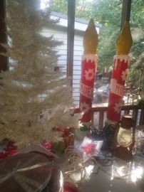 White artificial Christmas tree, Christmas yard decoration Noel candles, railroad lantern, & other décor.