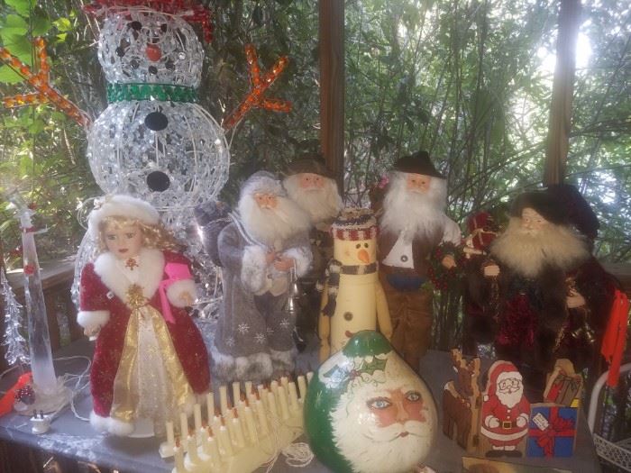 Christmas décor including large lighted snowman, Santa tree topper collection, window lights, & more.