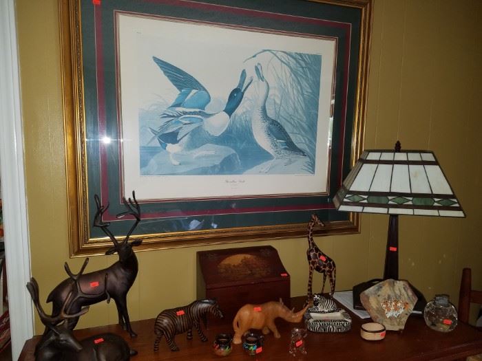 Shoveller Duck framed print, metal deer, zebra ashtray from Kenya, wooden carvings, stained glass type lamp, & more.