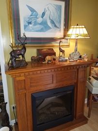 Electric fireplace/mantle, framed print, stained glass type lamp, animal sculptures/carvings, & more.