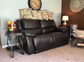 Genuine leather power recline love seat. Only 2 years old, like new. Also, has 3 years left on warranty that covers everything.