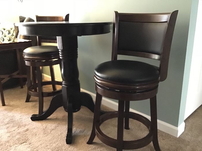 Counter height wood pedestal table.  Swivel Stools are also counter height.  Great for that small space in your home.