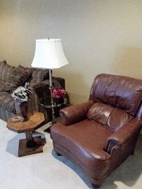 Leather chair, fair condition, has slight tear.  