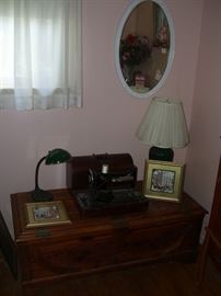 Vintage sewing machine and a cedar chest.