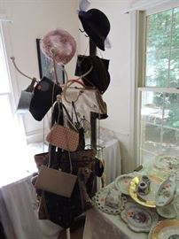 Hallway tree with purses and hats