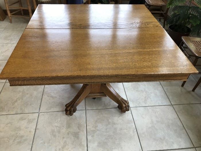 Antique oak tiger claw dining table with no leaves (44" X 44") , inc. 3 - 8" extensions ; with extensions- 68" x44"