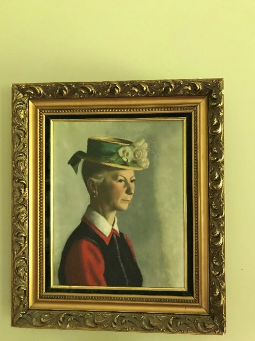 Framed painting of a lady with hat