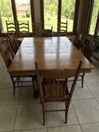 Antique oak tiger claw dining table/ 3 leaves/6 cane bottom chairs