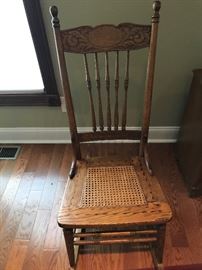 Antique oak rocking chair with cane bottom