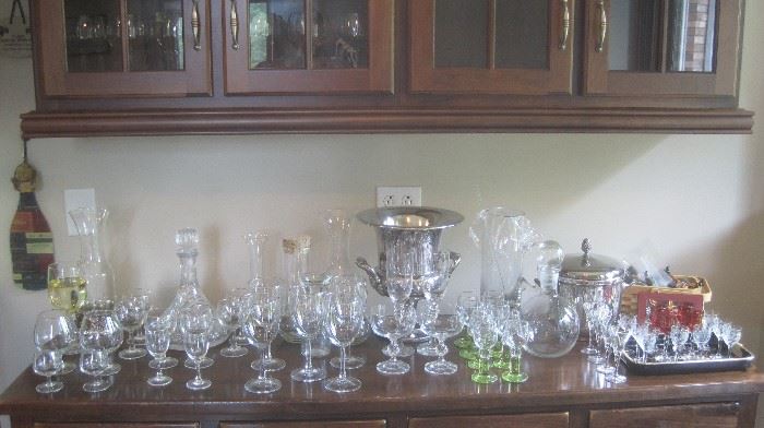 Large variety of wine stemware, silverplate champagne cooler, ice bucket, liquor glasses