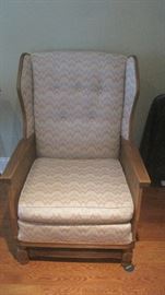 Large upholstered wooden wing back chair