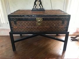 Louis Vuitton trunk on stand