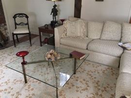 sectional sofa -From Scandinavian Design, -Glass top coffee table.