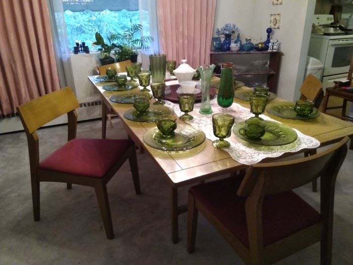 FANTASTIC MID CENTURY MODERN DINNING SET. 
$400 OBO. TABLE FOLDS DOWN 4 CHAIRS AND TABLE PADS WITH A HUTCH (WILL BREAK UP THE SET)
