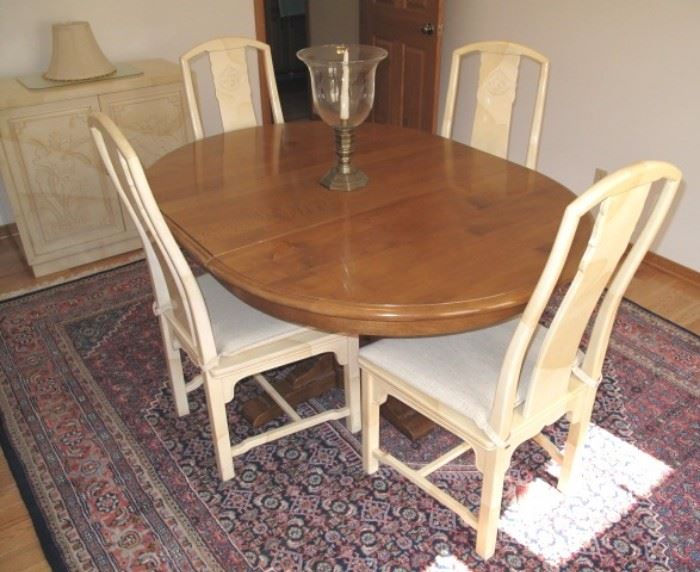 Fine and unusual Henredon dining set and cabinet.