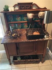 Arts and Crafts marble topped sideboard cabinet (marble has an old split) with art nouveau tile back splash, circa 1910. Measures 3' across. Also l to r: centerpiece, woven basket with damaged lip Bear Bowl and   hide and twig horse sculpture.