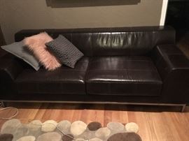 IKEA steel frame and dark chocolate leather sofa Easily sets 3 and measures approximately 88" in length.