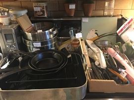 cast iron skillets, large open roaster, kitchen gadgets, stainless bowls