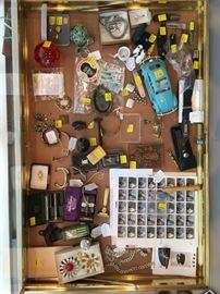 Collectibles and antiques, including stamps, one of two vintage Hubleys, vintage jewelry, antique/vintage shaving shaving kits, vintage Viking glass, Elvis fan club pin, pocketknives, antique salesman sample iron