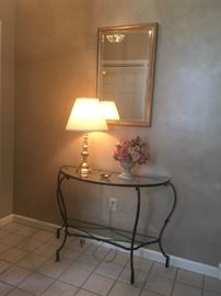 console table, mirror, lamp, and arrangement