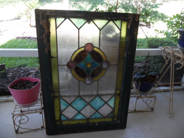 Stain glass window. Vintage window weights in frame