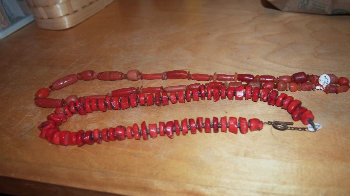 These are the only two coral necklaces.  One in front is dyed coral and one in back is most likely sponge coral not dyed.