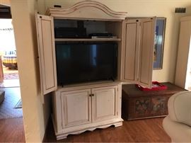 “Country French” armoire *TV, electronics & other furniture pictured are not included with this auction lot*