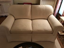 Custom built love seat by Prade, Inc. Features “box spring” construction and cushions made with foam and wrapped in down material.