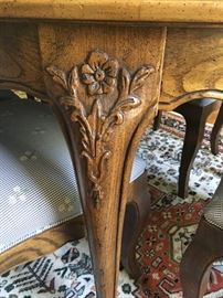 Hand carvings on legs of dining room table
