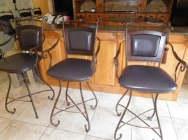 Six iron swivel bar stools