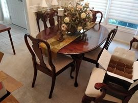 Dining room table and 6 chairs, two leaves