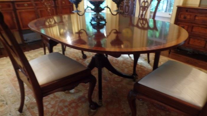 Baker oval dining room table with two 18"  leaf's ..6'- 7' long ...$800.00