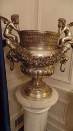 grand silver  urn with stand, $6,200