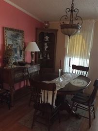 Oak round dining table with claw feet, four engraved chairs (see other photo for close-up), and two leaves