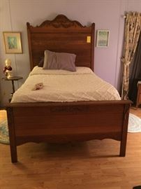 Antique full-size bed, artwork