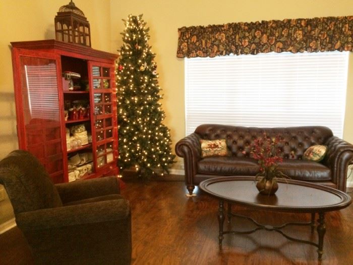 Christmas tree   oval coffee table    leather sofa     swirling chair there is a pair of these chairs like new 