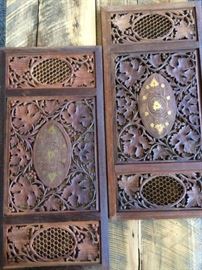 Pair of old carved wood decorative panels with inlaid gold accents. Both are wired for hanging on a wall.  11" x 23" $50