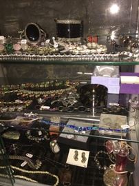 Sterling silver items,  miniature collectible snowbabies, and a variety of rings, bracelets, necklaces,  and earrings. Pricing varies