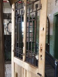 Natural wood door (no finish) with great iron decor and details. 7'-2.5"H x 3'-1"W $450
