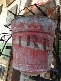 This amazing old fire bucket has a curved out bottom because they used sand to fill them instead of water. A unique find from Chicago.  $60