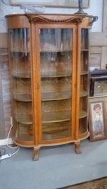 American rift Oak Bowed glass display cabinet with paw foot and columns