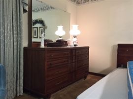 "Kling" solid cherry low dresser/vanity on casters. Dimensions (without mirror) 34" height x 60" width x 21" depth. With mirror 68" height. Excellent conditions.