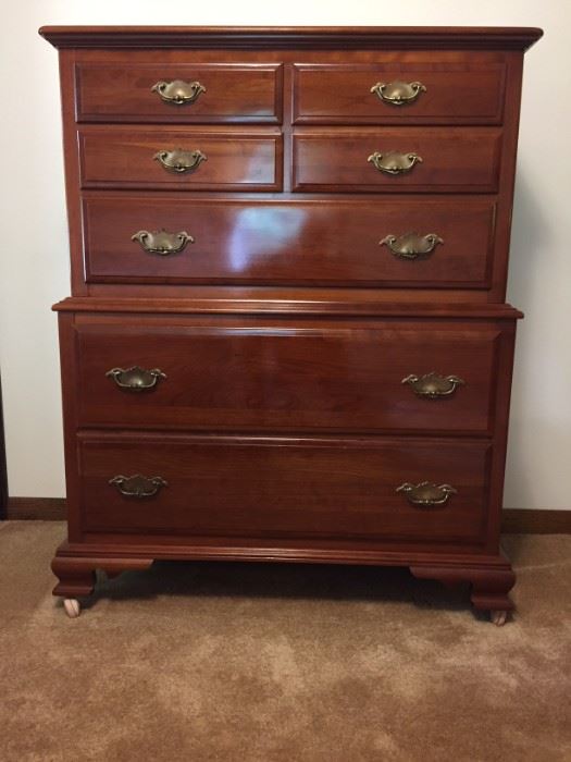 Solid cherry tall dresser on casters.  Dimensions 50.5" height x 40" width x 20" depth.  Excellent condition.