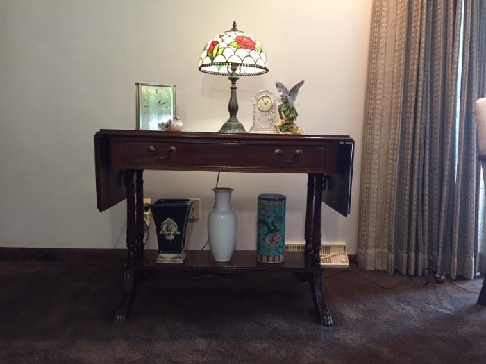 1950's / 1960's sold wood drop leaf table with single shelf.  Dimensions when leaves are down 28" height x 36" width x 24" depth.  Excellent condition.