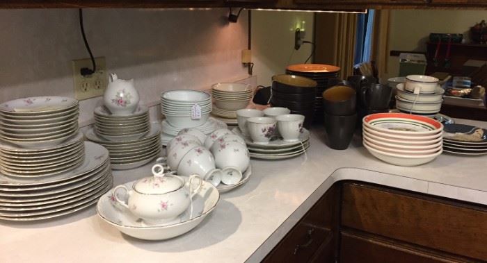 Multiple sets of dinnerware.