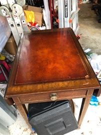 A PAIR OF LEATHER TOP DROP LEAF SIDE TABLES
