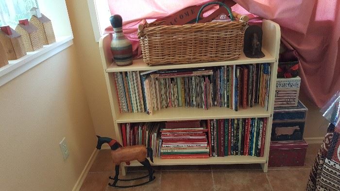 Children's books, wicker basket, toys, wooden town homes, boxes