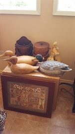 Duck decoys, wooden table, framed art